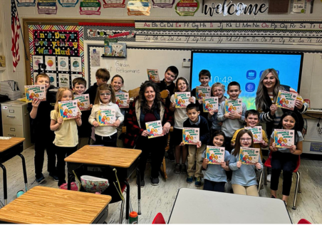 Rogers City staff celebrate March is Reading Month with St. Ignatius Students
